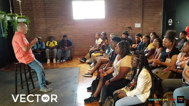Jeff Hoffman speaking to a room of seated Dream Hustle Code students